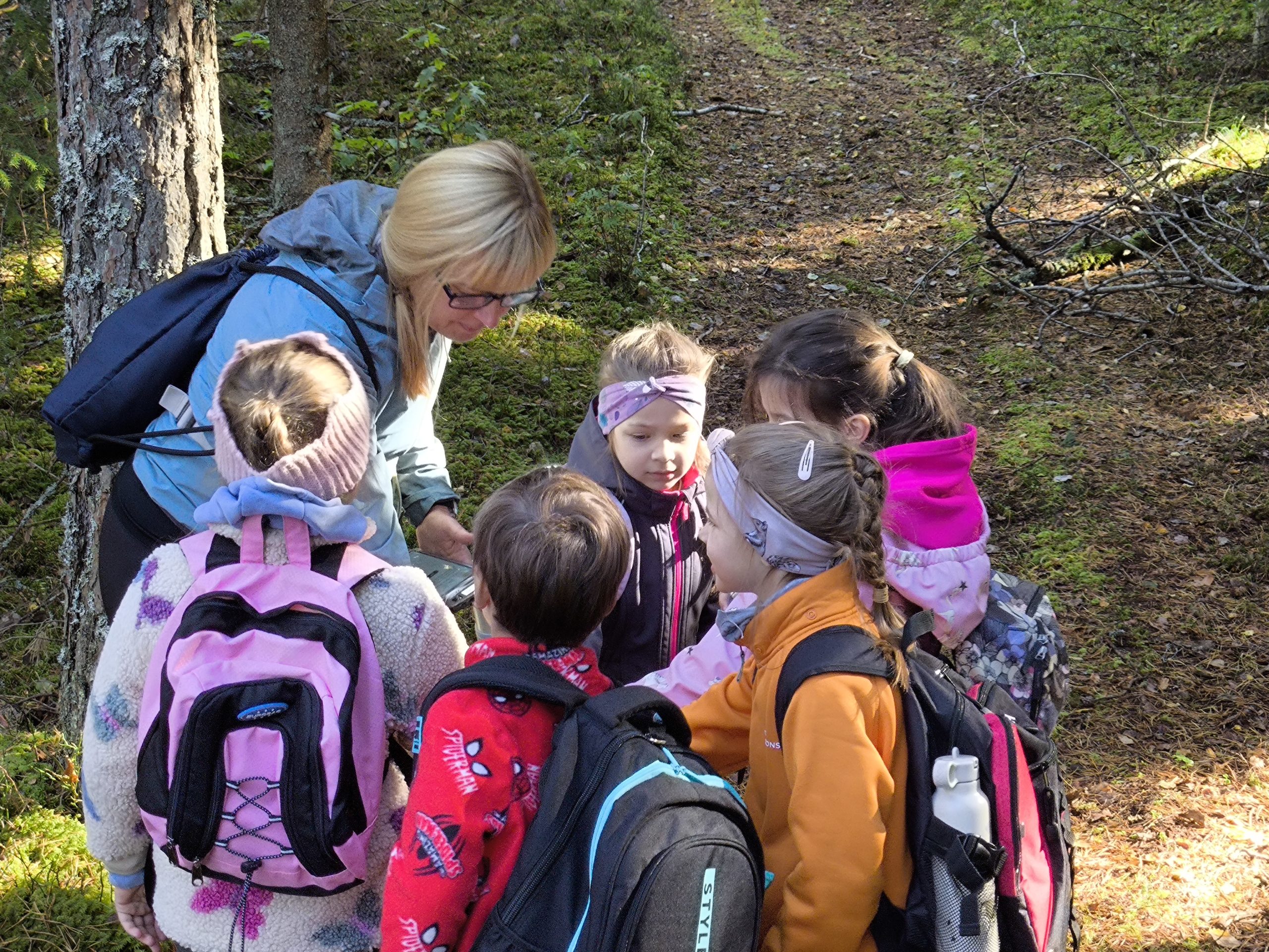 children explore a new loop trail and digital game on the forest trail